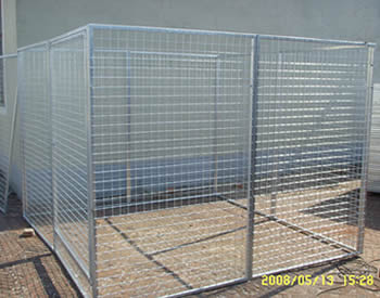A robust galvanized dog kennel on the ground in our company yard.
